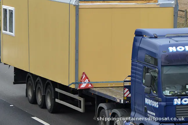 Part of a portable cabin on an articulated lorry on the M6 Part of a portable cabin on an articulated lorry on the M6