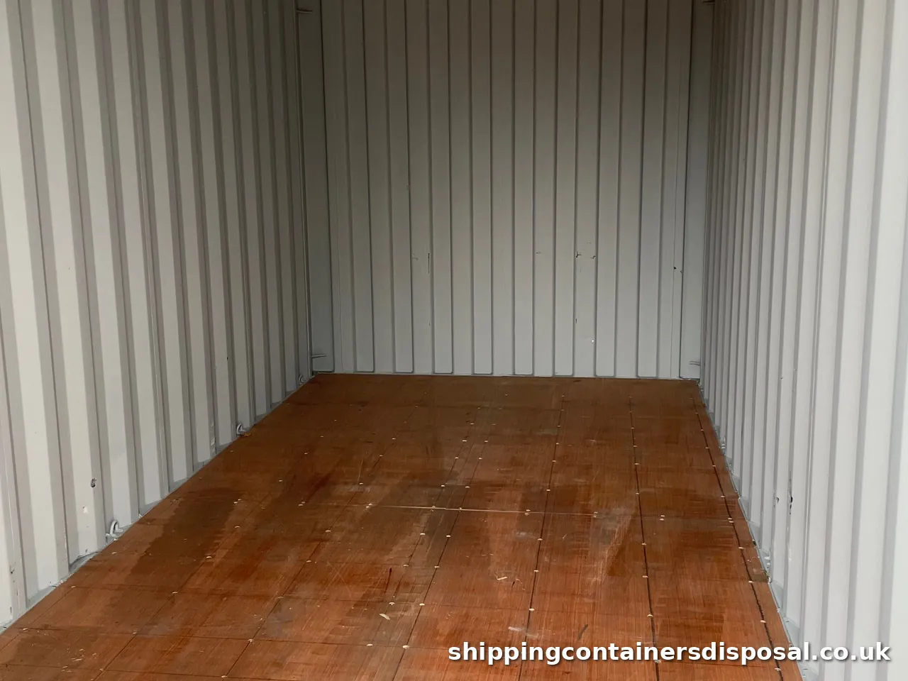 Clean shipping container interior with a sound timber floor Clean shipping container interior with a sound timber floor