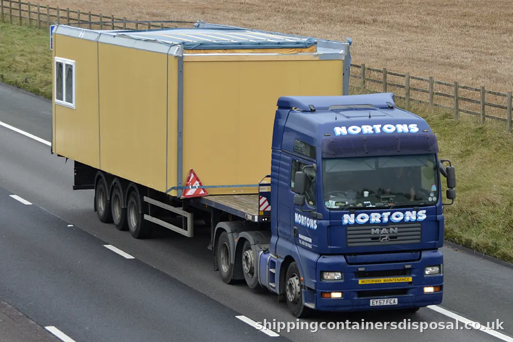 Articulated lorry carrying a portable cabin on the M6 Articulated lorry carrying a portable cabin on the M6