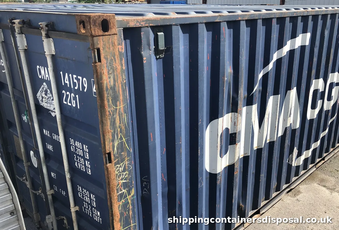 Corner of a used 20ft shipping container with rust along the frame Corner of a used 20ft shipping container with rust along the frame