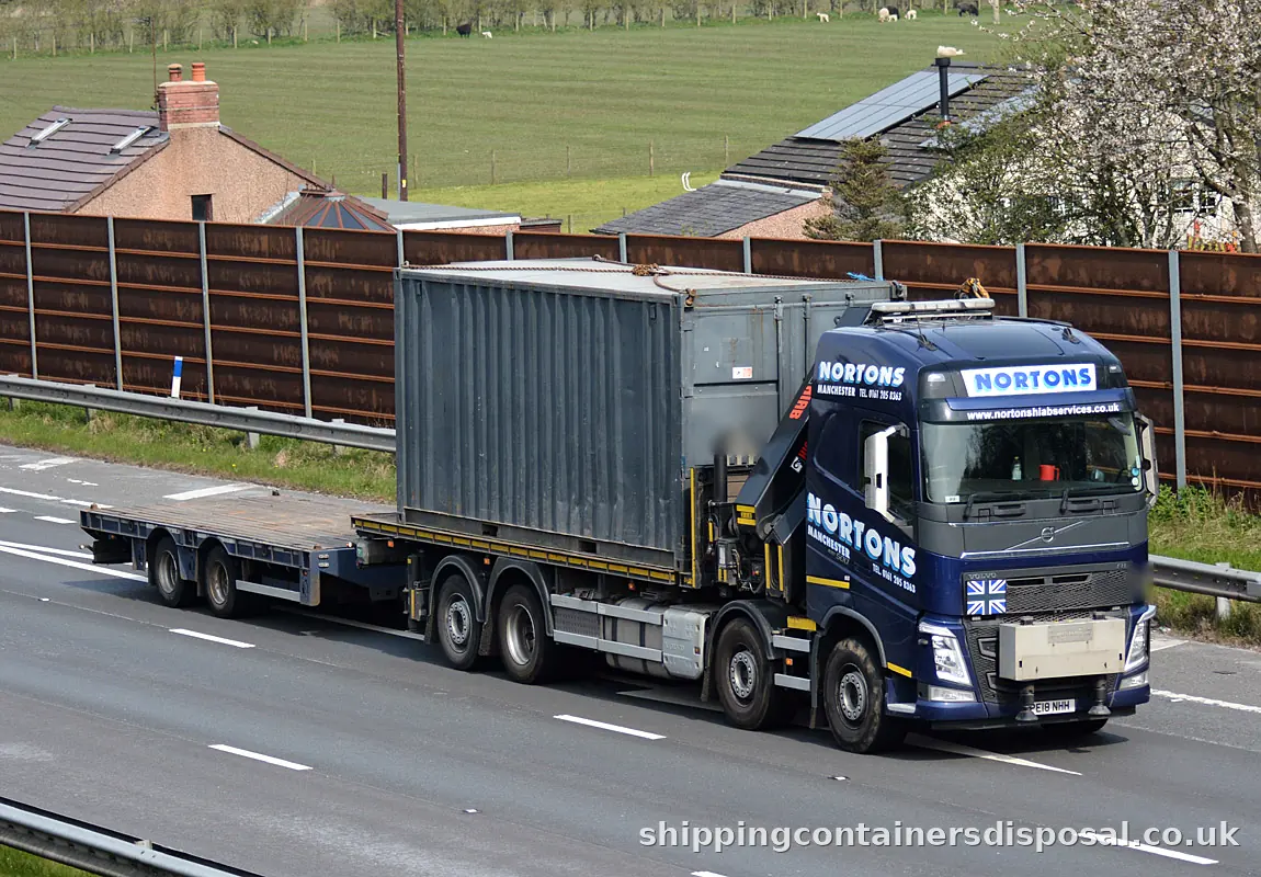 Steel container loaded on a HIAB lorry on the M6