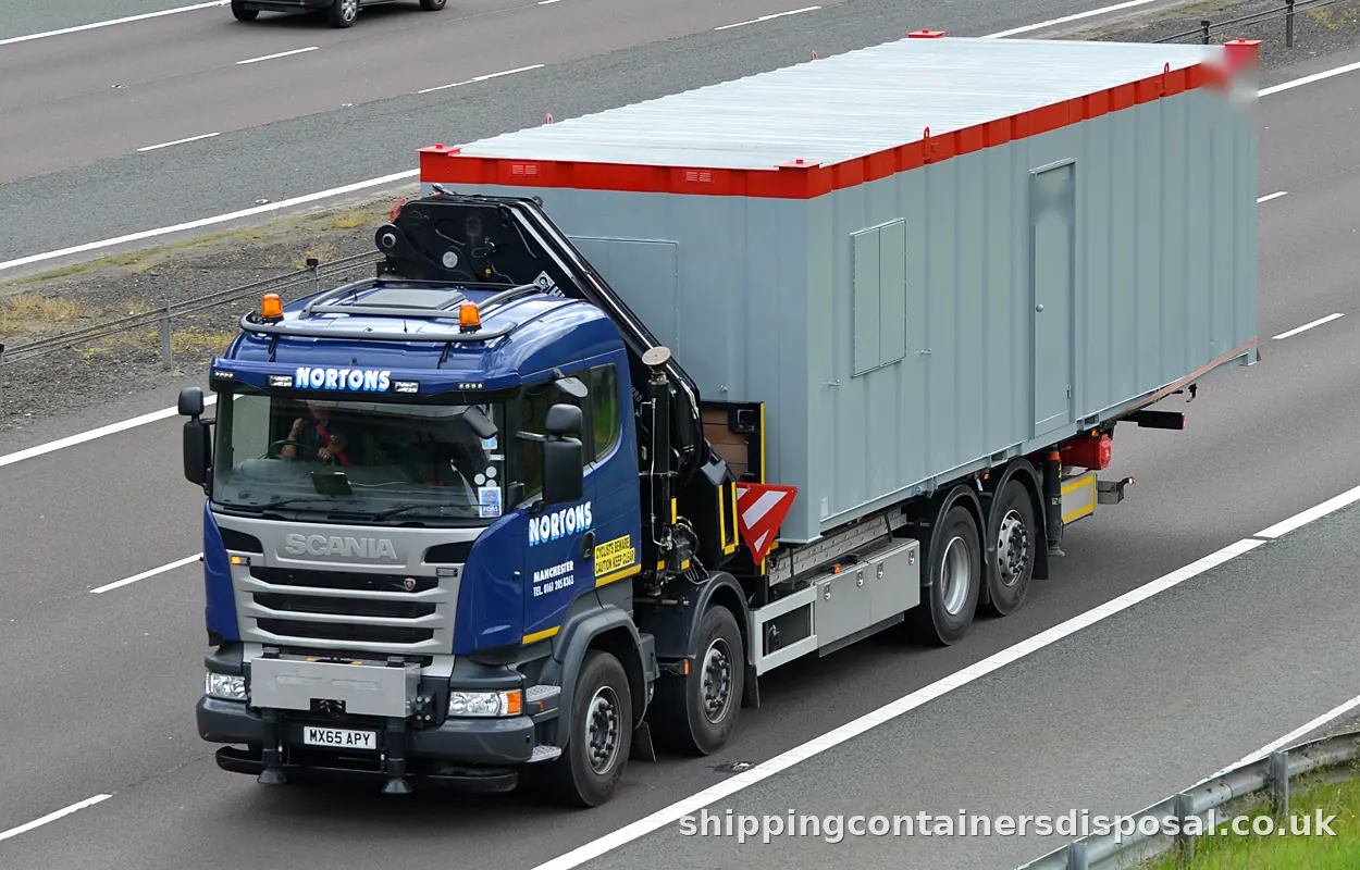 Scania HIAB lorry carrying a grey site unit on the M74 Scania HIAB lorry carrying a grey site unit on the M74