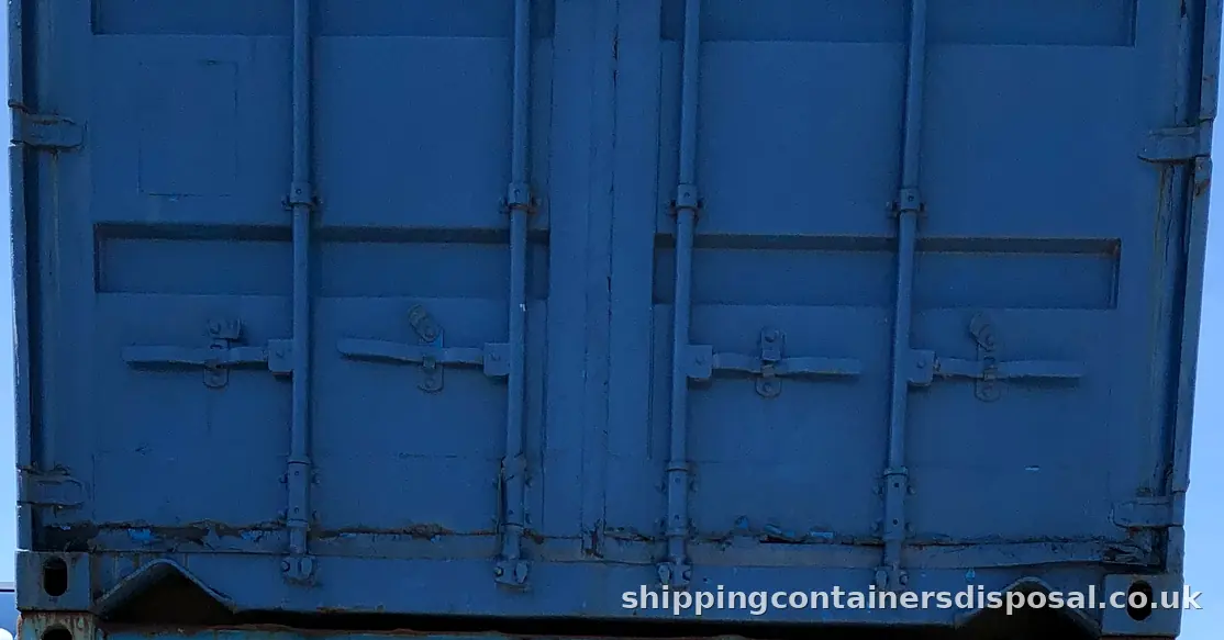Doors of a stacked blue shipping container Doors of a stacked blue shipping container