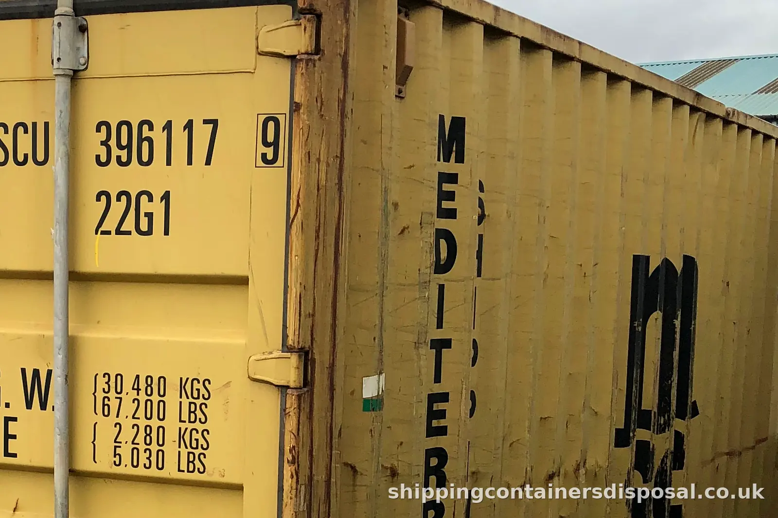 Another view of the doors of a yellow 20ft shipping container Another view of the doors of a yellow 20ft shipping container